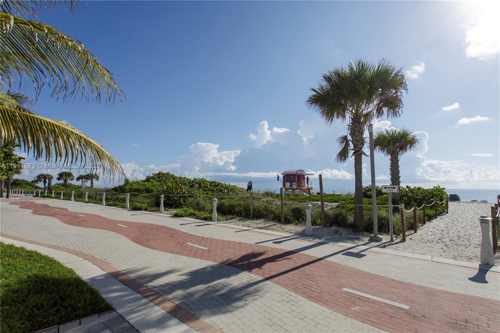 5001 Collins Avenue, Unit PH1 Miami Beach, FL 33140 - Photo 69 of 82 a front view of a house with a yard and garage