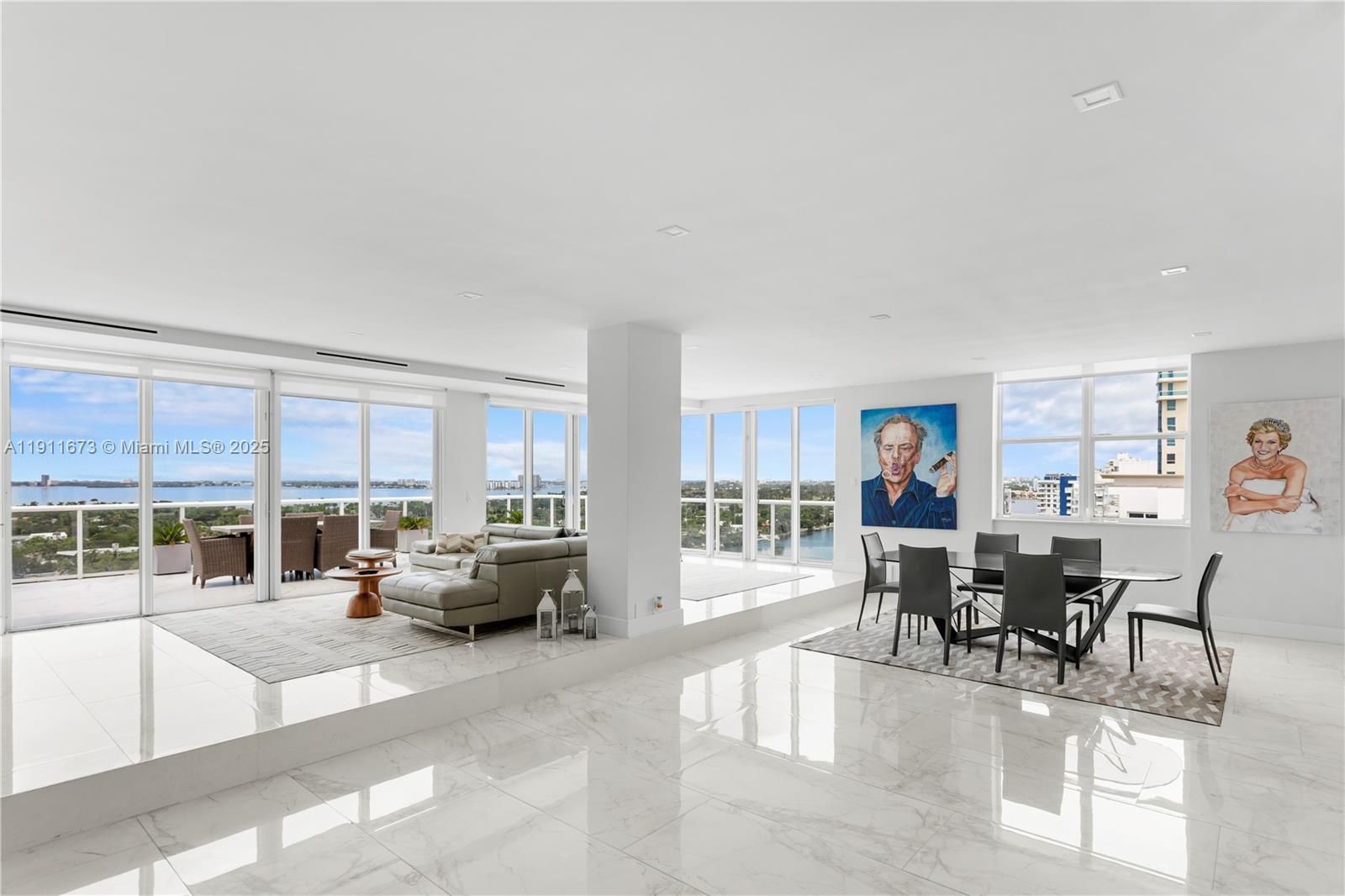 5001 Collins Avenue, Unit PH1 Miami Beach, FL 33140 - Photo 10 of 82 a living room with furniture and a large window