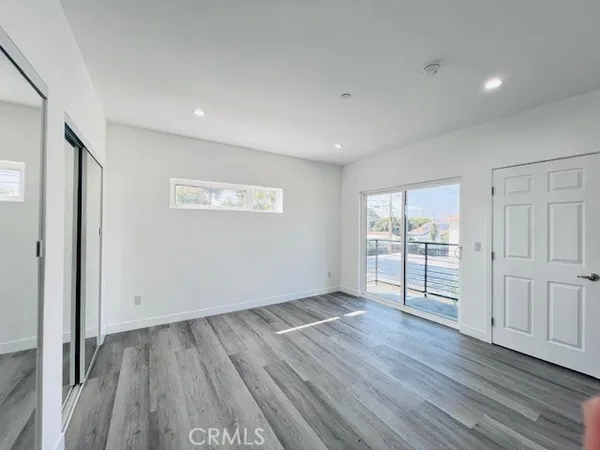 a bathroom with a double vanity sink and mirror with bathtub