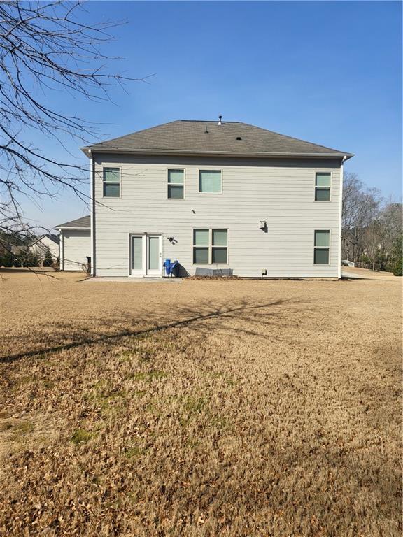 2595 Jupiter Drive Southwest Powder Springs, GA 30127 - Photo 25 of 26 a front view of a house with a yard