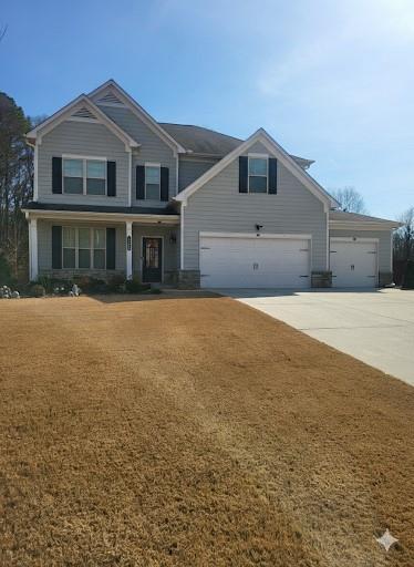 2595 Jupiter Drive Southwest Powder Springs, GA 30127 - Photo 3 of 26 a front view of a house with a yard