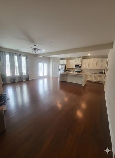2595 Jupiter Drive Southwest Powder Springs, GA 30127 - Photo 6 of 26 a view of empty room with wooden floor