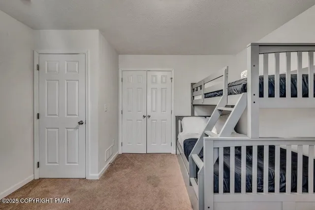 a living room with a cabinets and a couch