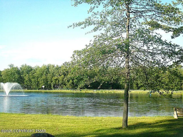 a view of a large body of water with a house