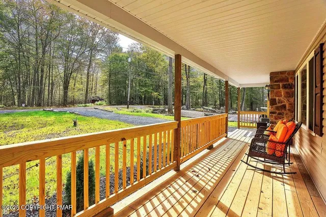 a view of swimming pool with seating area