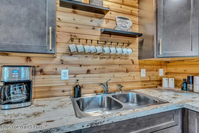 a kitchen with a sink and cabinets