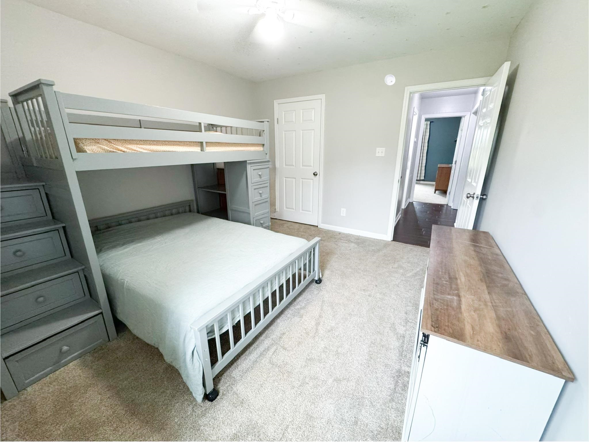 4776 Campground Road Munford, TN 38058 - Photo 6 of 25 a bedroom with a bed and a flat tv screen