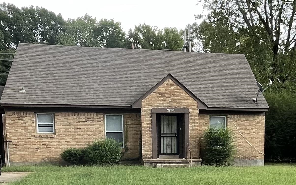 3804 Cazassa Road Memphis, TN 38116 - Photo 1 of 17 View of front of home with brick siding and a front yard