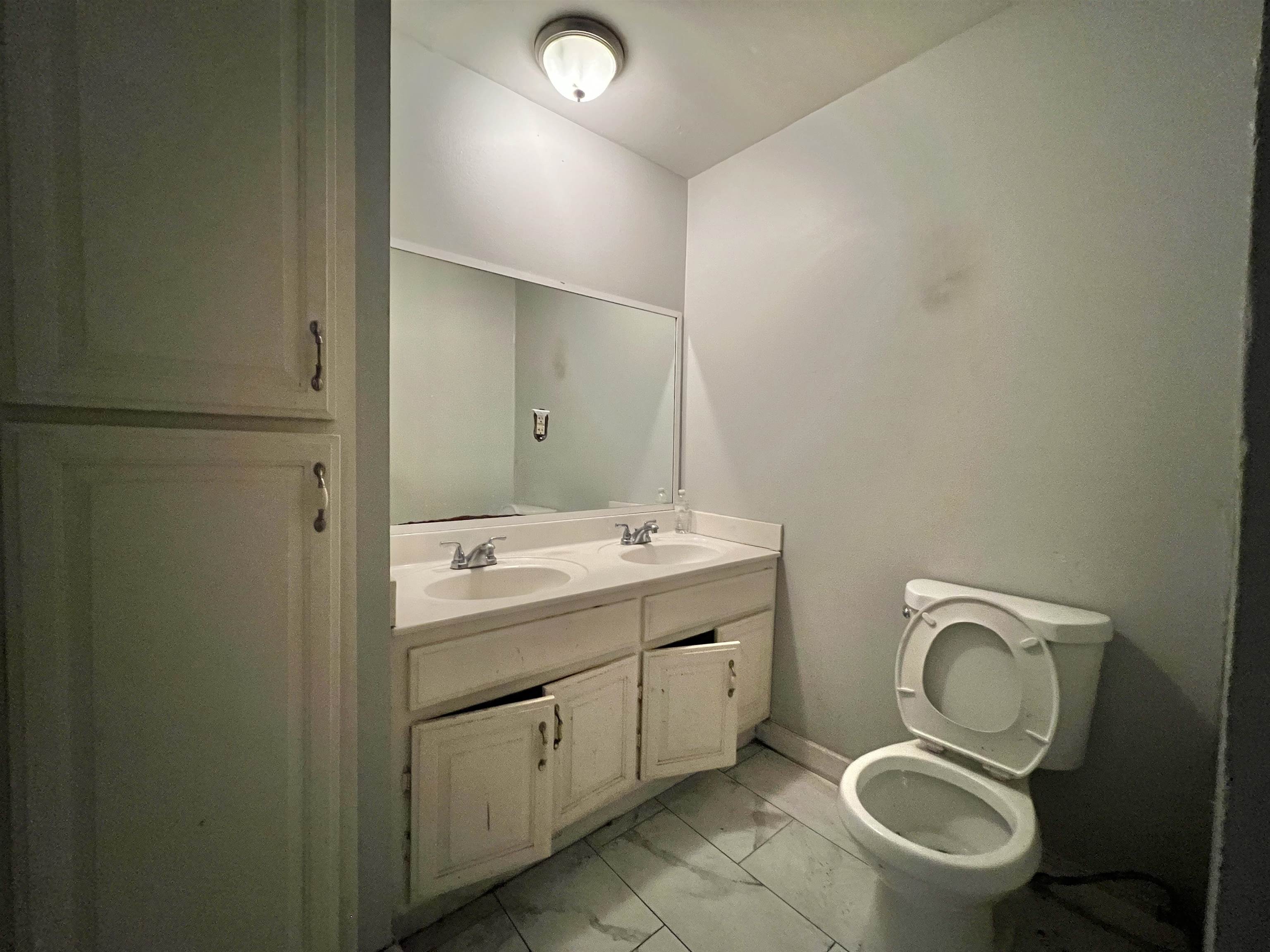 3804 Cazassa Road Memphis, TN 38116 - Photo 7 of 17 Full bath featuring light marble finish flooring and double vanity