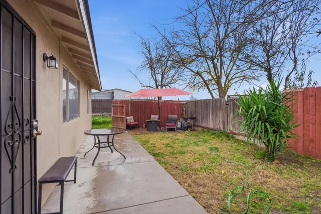 a view of a backyard with furniture