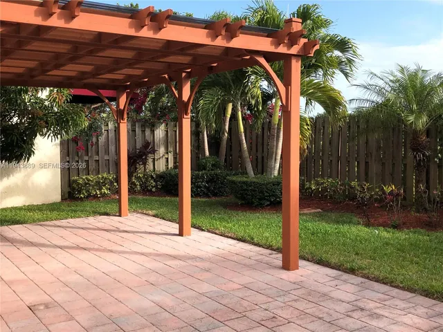 an aerial view of a house with a lake view