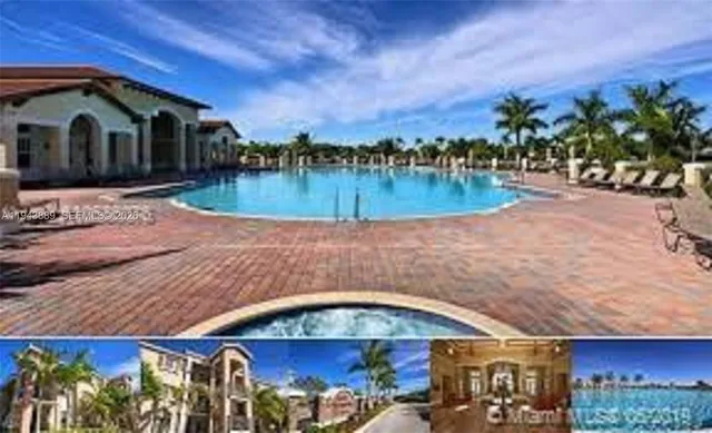 a living room with furniture a chandelier and a large window