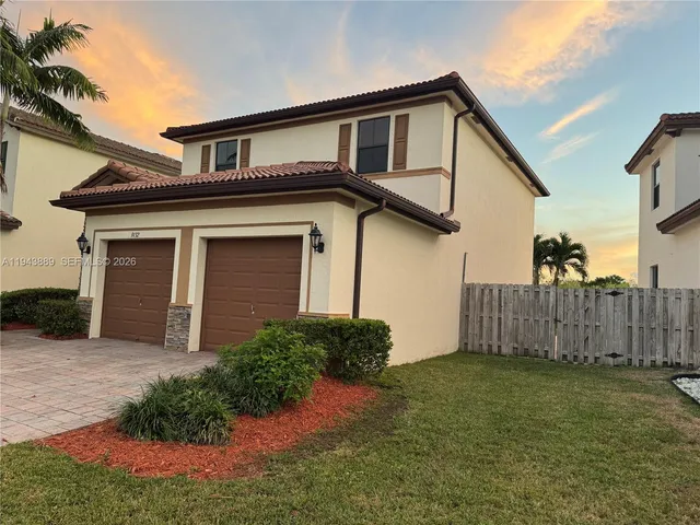 a view of small yard with wooden fence