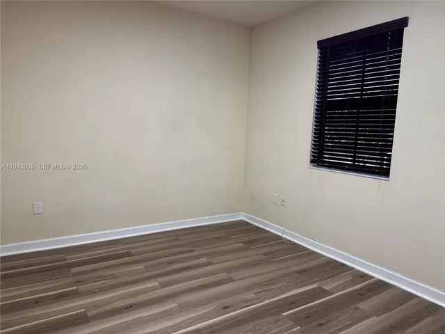 a front view of a house with yard and green space