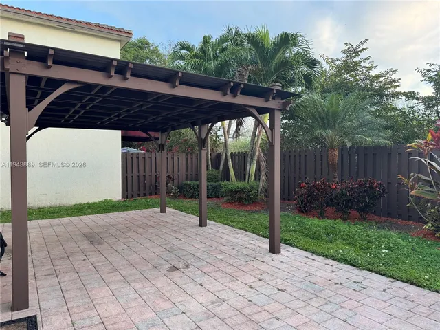 a view of a swimming pool with a lake view and a garden