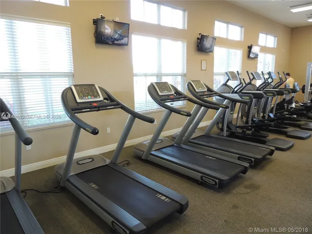 a view of swimming pool with outdoor seating and yard