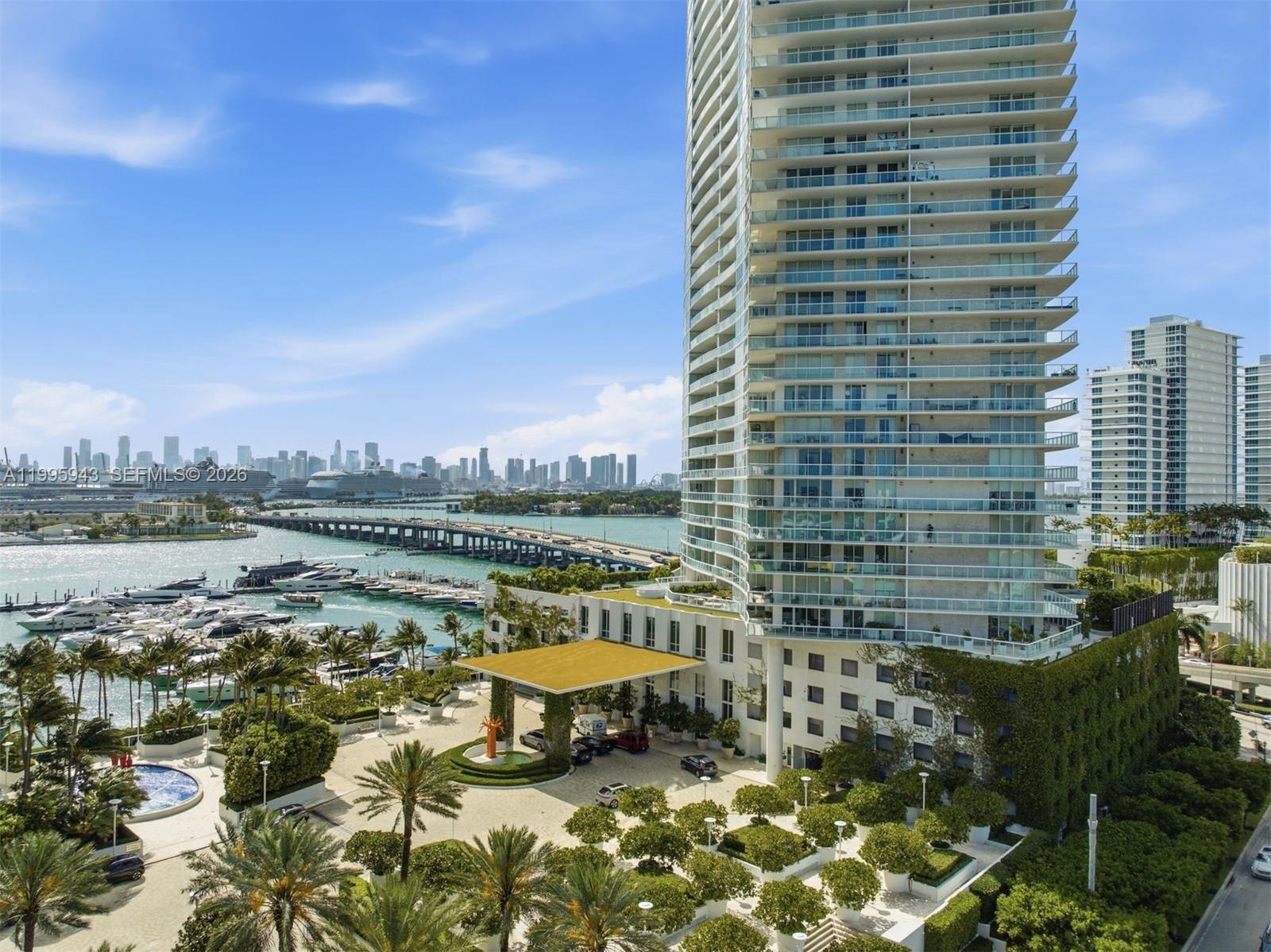 450 Alton Road, Unit 910 Miami Beach, FL 33139 - Photo 39 of 59 a view of swimming pool with outdoor seating and city view