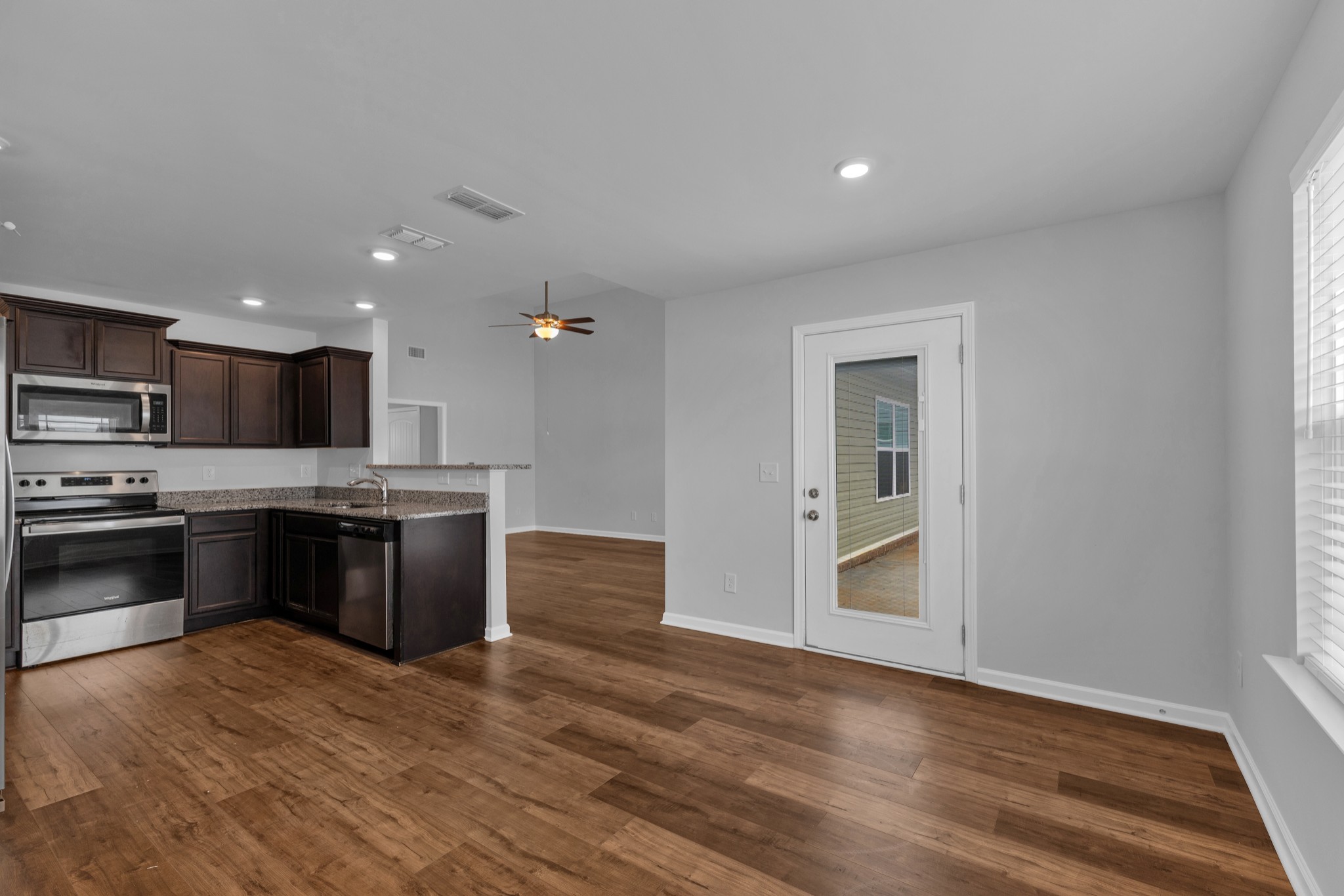 328 Turney Lane Spring Hill, TN 37174 - Photo 11 of 35 a large kitchen with stainless steel appliances granite countertop a large counter top and a stove top oven