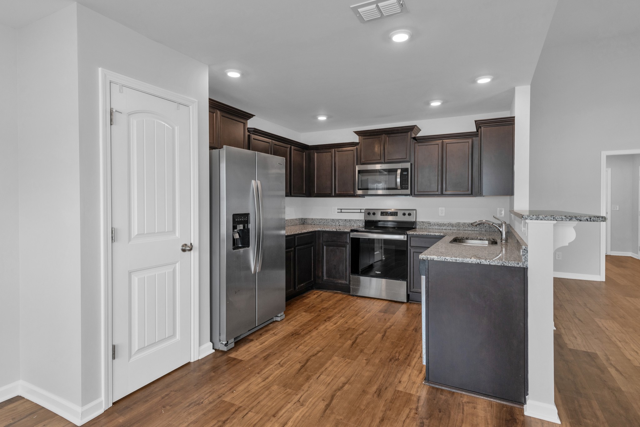 328 Turney Lane Spring Hill, TN 37174 - Photo 12 of 35 a kitchen with stainless steel appliances granite countertop a refrigerator and a stove top oven