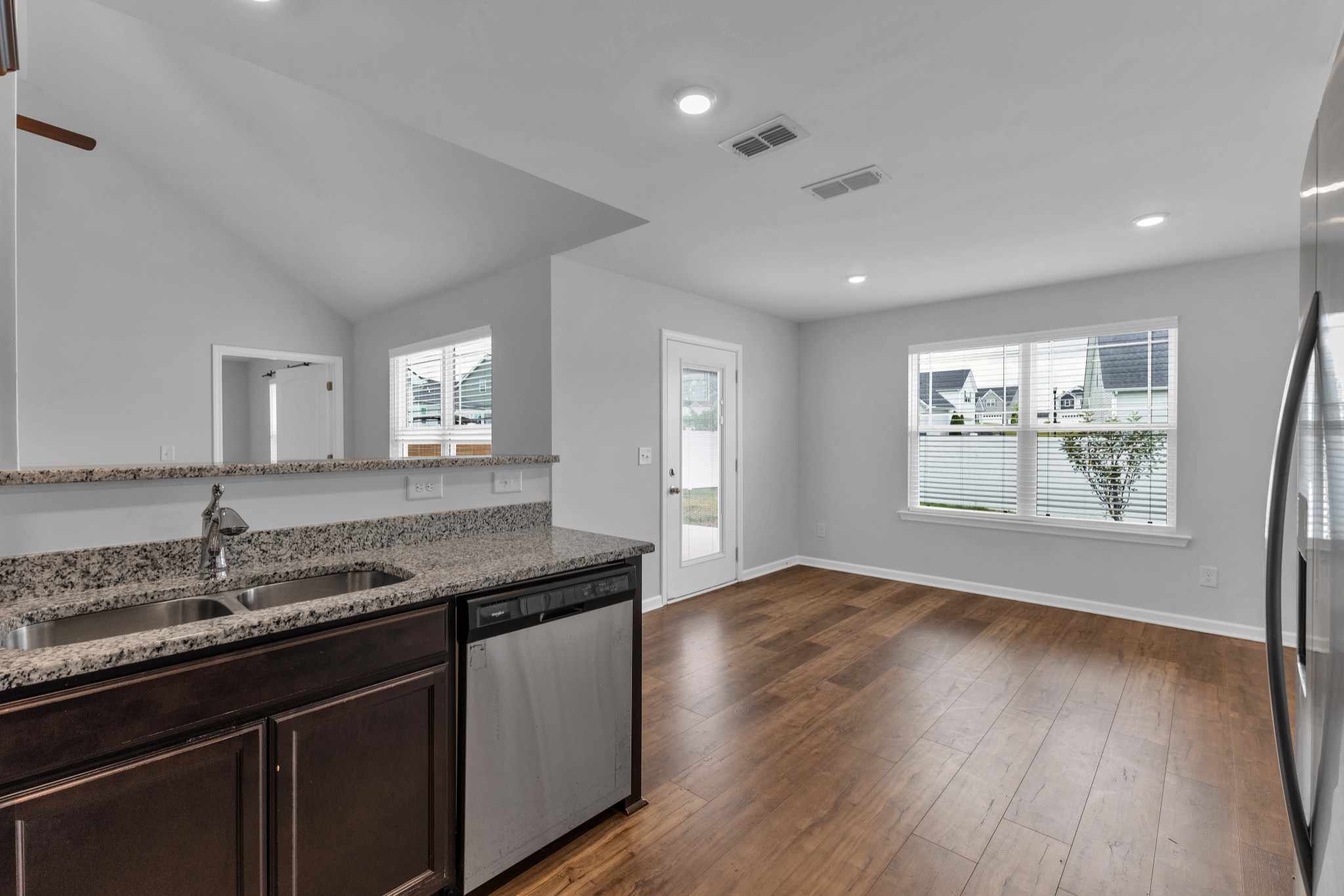 328 Turney Lane Spring Hill, TN 37174 - Photo 14 of 35 a kitchen with granite countertop a sink and wooden floor