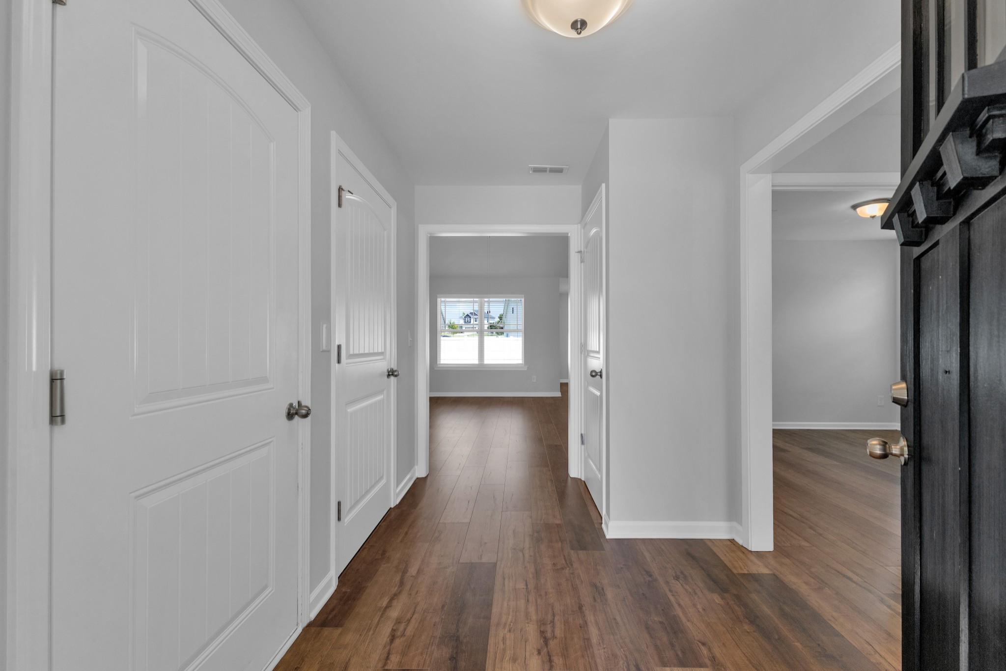 328 Turney Lane Spring Hill, TN 37174 - Photo 6 of 35 a view of a hallway with wooden floor and staircase