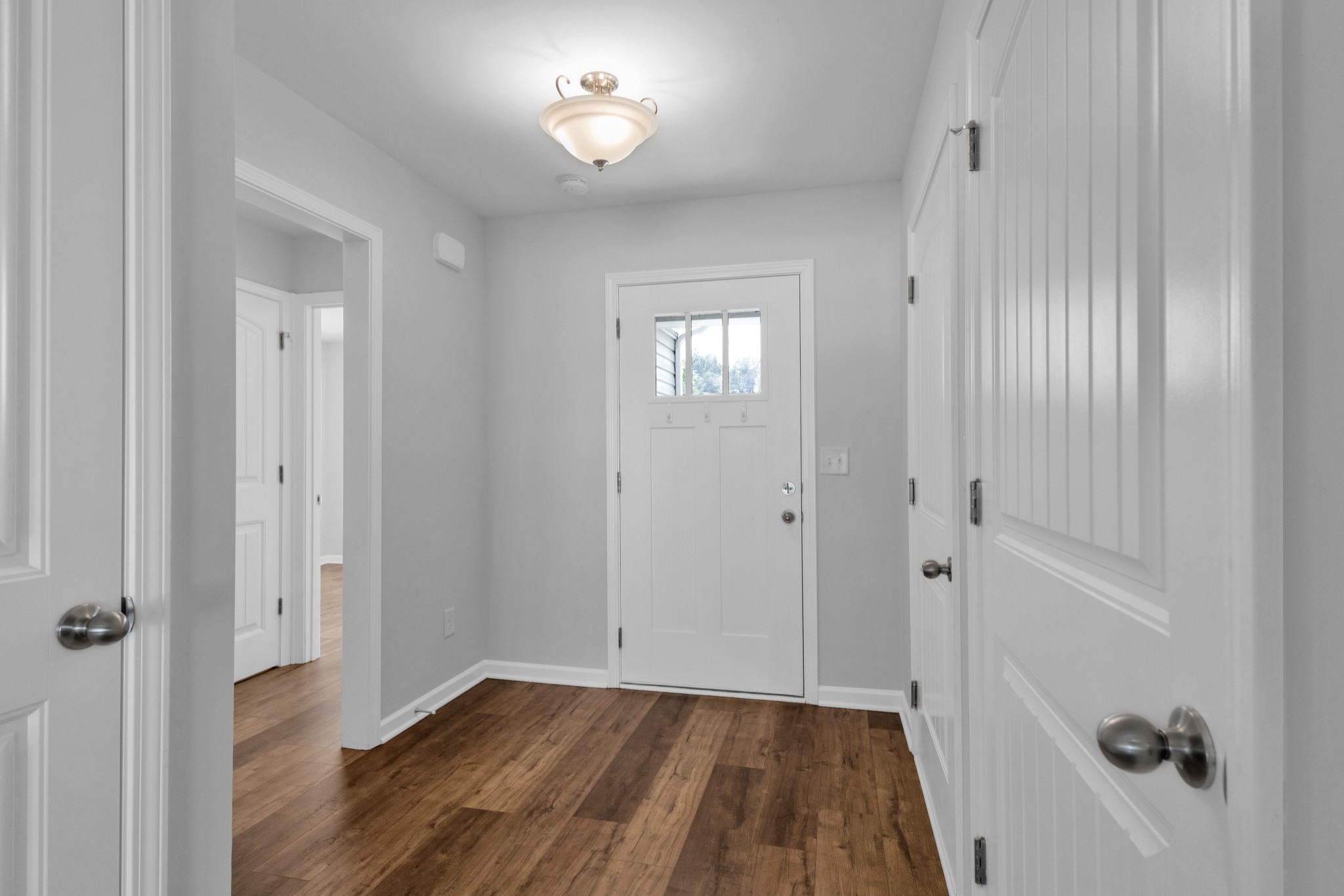 328 Turney Lane Spring Hill, TN 37174 - Photo 7 of 35 a view of a hallway with wooden floor