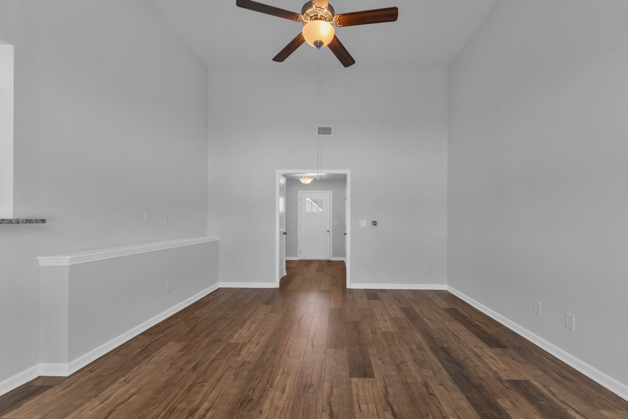 328 Turney Lane Spring Hill, TN 37174 - Photo 9 of 35 a view of an empty room with wooden floor and a window