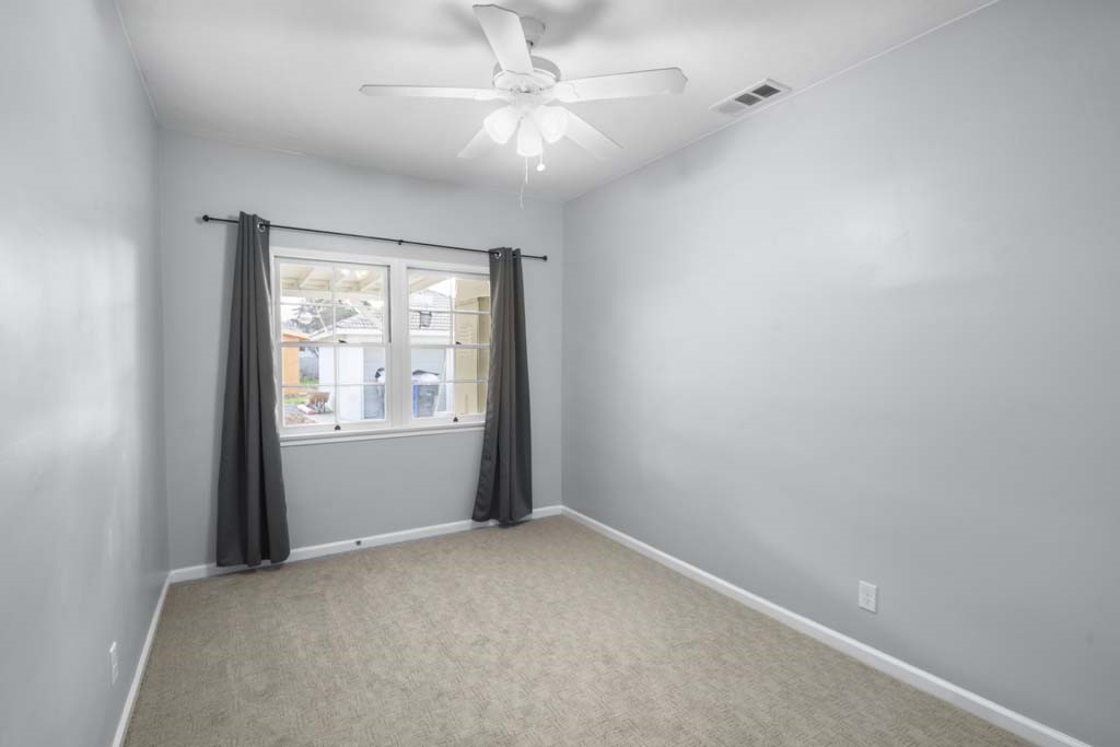 6650 Palm Avenue Riverside, CA 92506 - Photo 15 of 18 an empty room with windows and fan