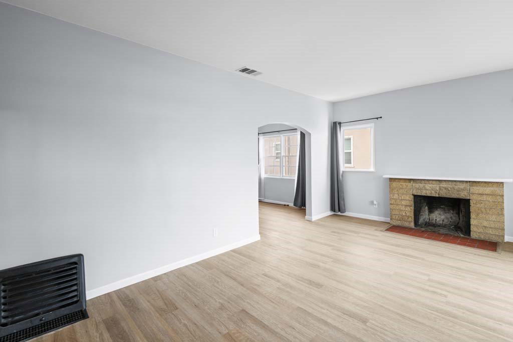 6650 Palm Avenue Riverside, CA 92506 - Photo 5 of 18 a view of empty room with wooden floor and fireplace