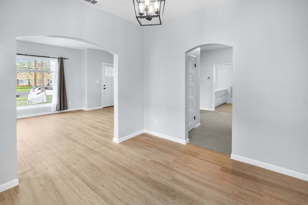 6650 Palm Avenue Riverside, CA 92506 - Photo 7 of 18 an empty room with wooden floor and windows