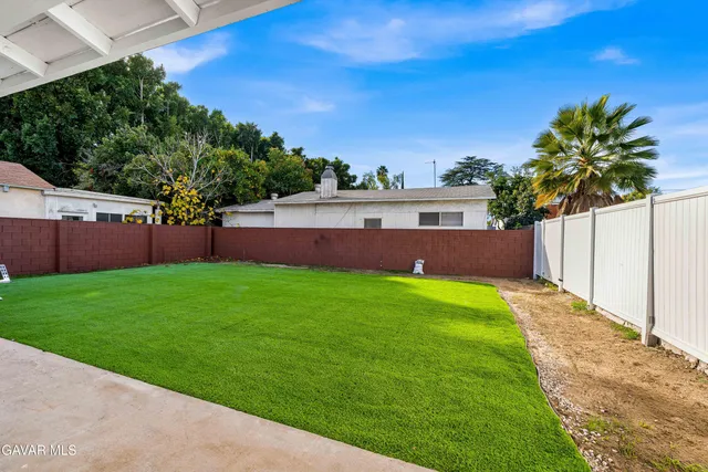a view of yard with swimming pool