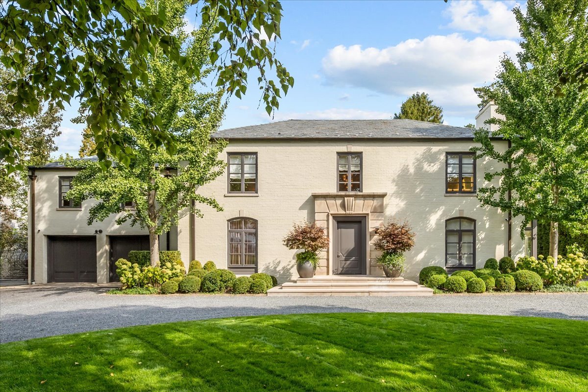 1106 Seneca Road Wilmette, IL 60091 - Photo 1 of 79 a front view of a house with a yard and potted plants