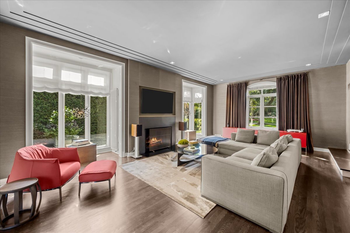 1106 Seneca Road Wilmette, IL 60091 - Photo 16 of 79 a living room with furniture a fireplace and a large window