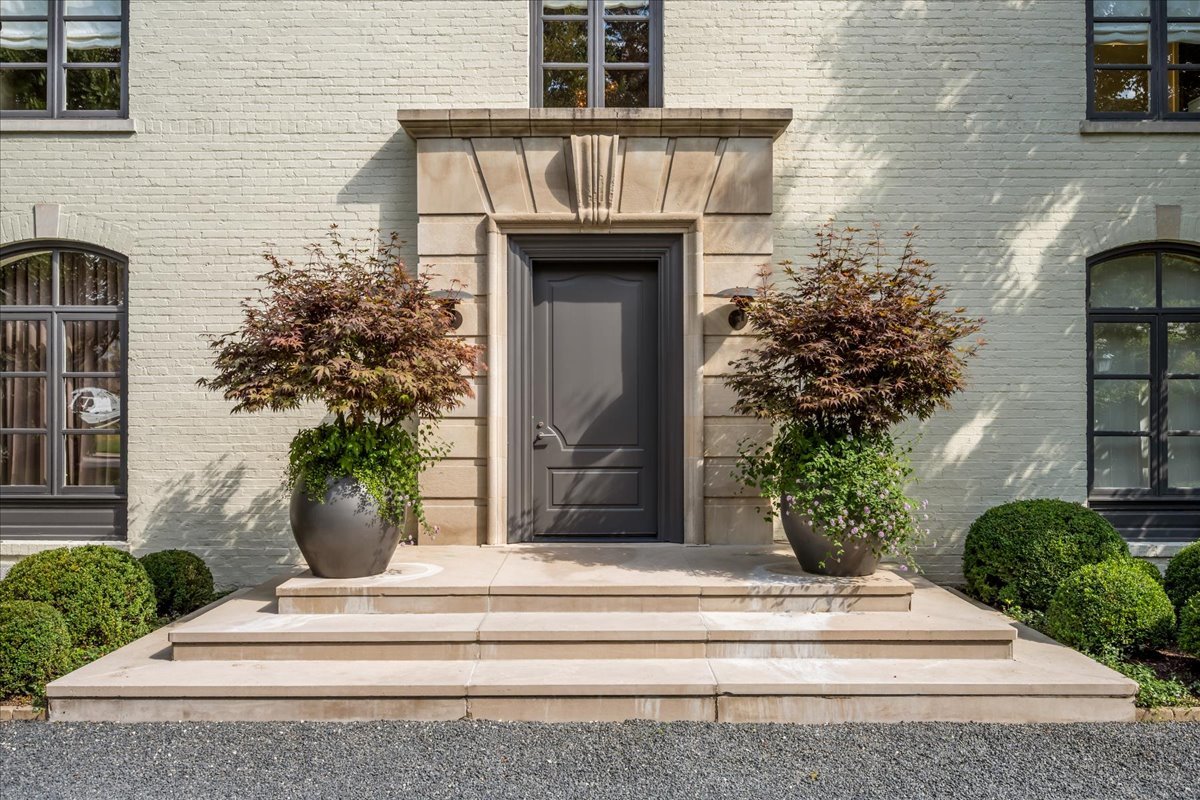 1106 Seneca Road Wilmette, IL 60091 - Photo 2 of 79 a front view of a house with potted plants