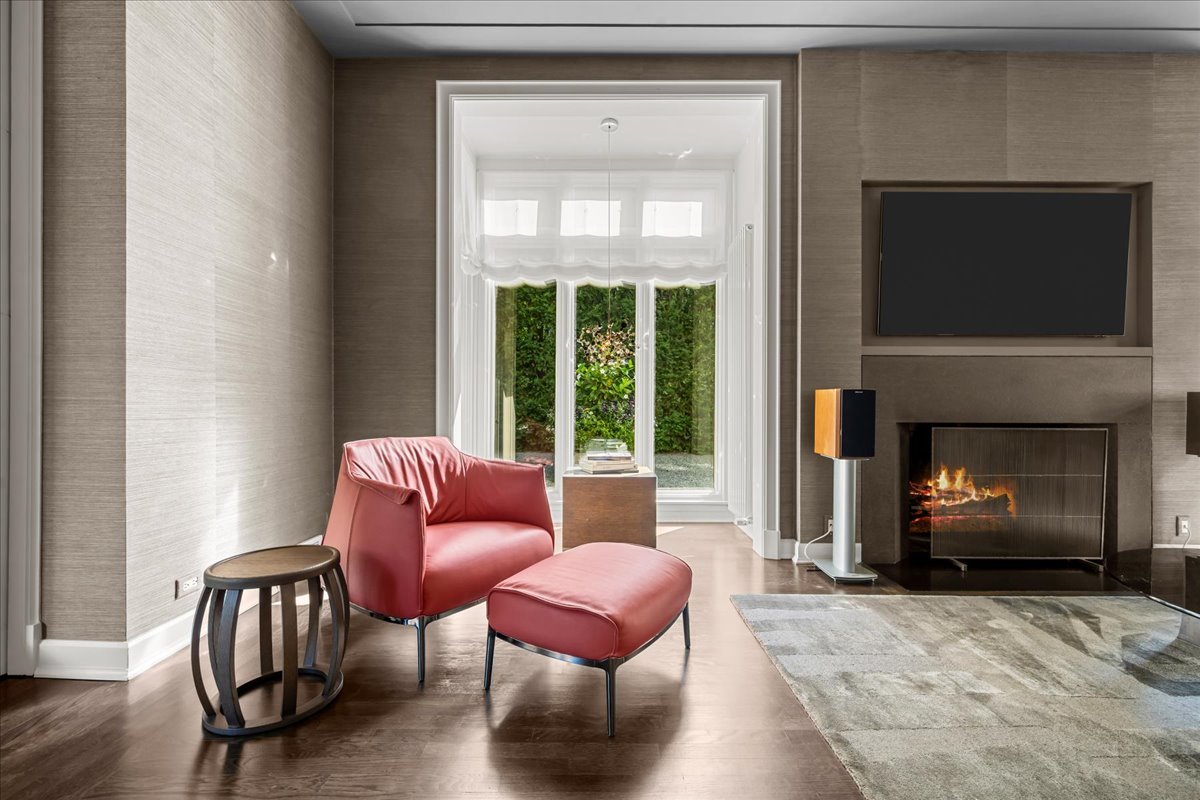 1106 Seneca Road Wilmette, IL 60091 - Photo 21 of 79 a living room with furniture a flat screen tv and a fireplace