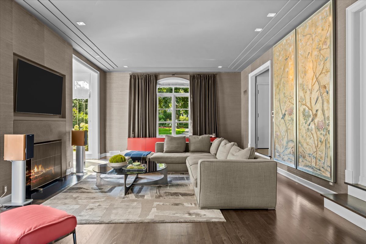 1106 Seneca Road Wilmette, IL 60091 - Photo 22 of 79 a living room with fireplace furniture and a flat screen tv