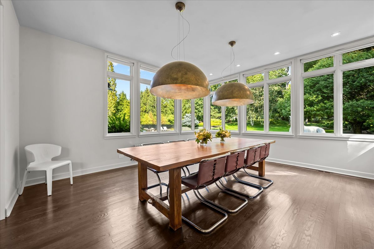 1106 Seneca Road Wilmette, IL 60091 - Photo 24 of 79 a view of a dining room with furniture window and wooden floor