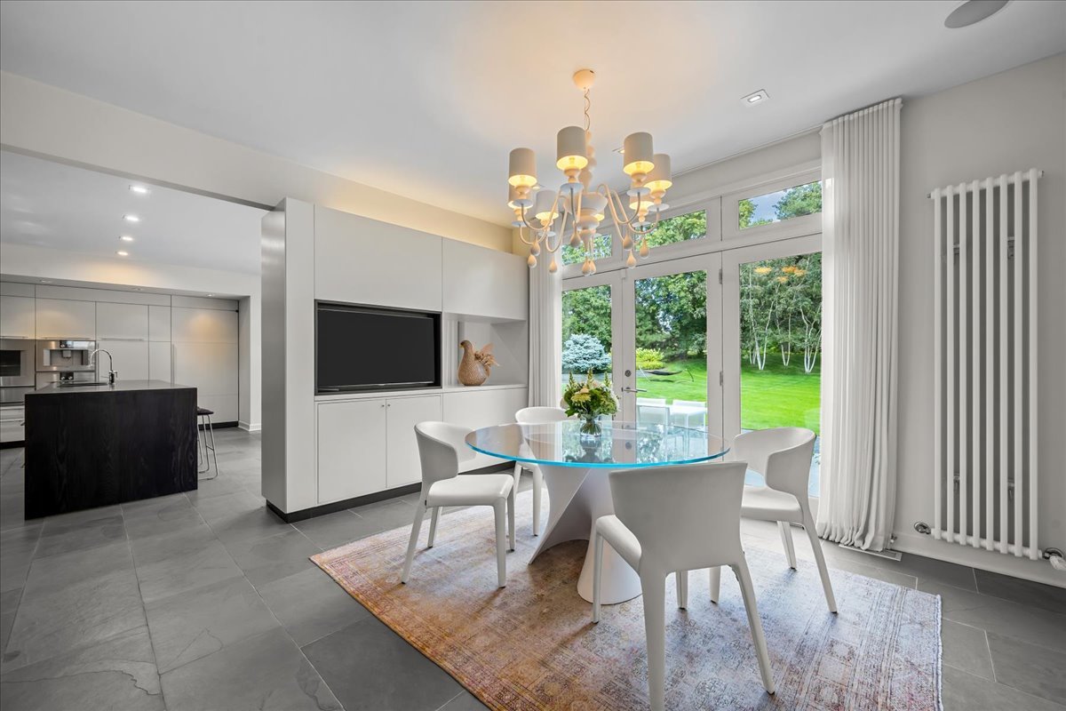 1106 Seneca Road Wilmette, IL 60091 - Photo 27 of 79 a view of a dining room with furniture window and wooden floor