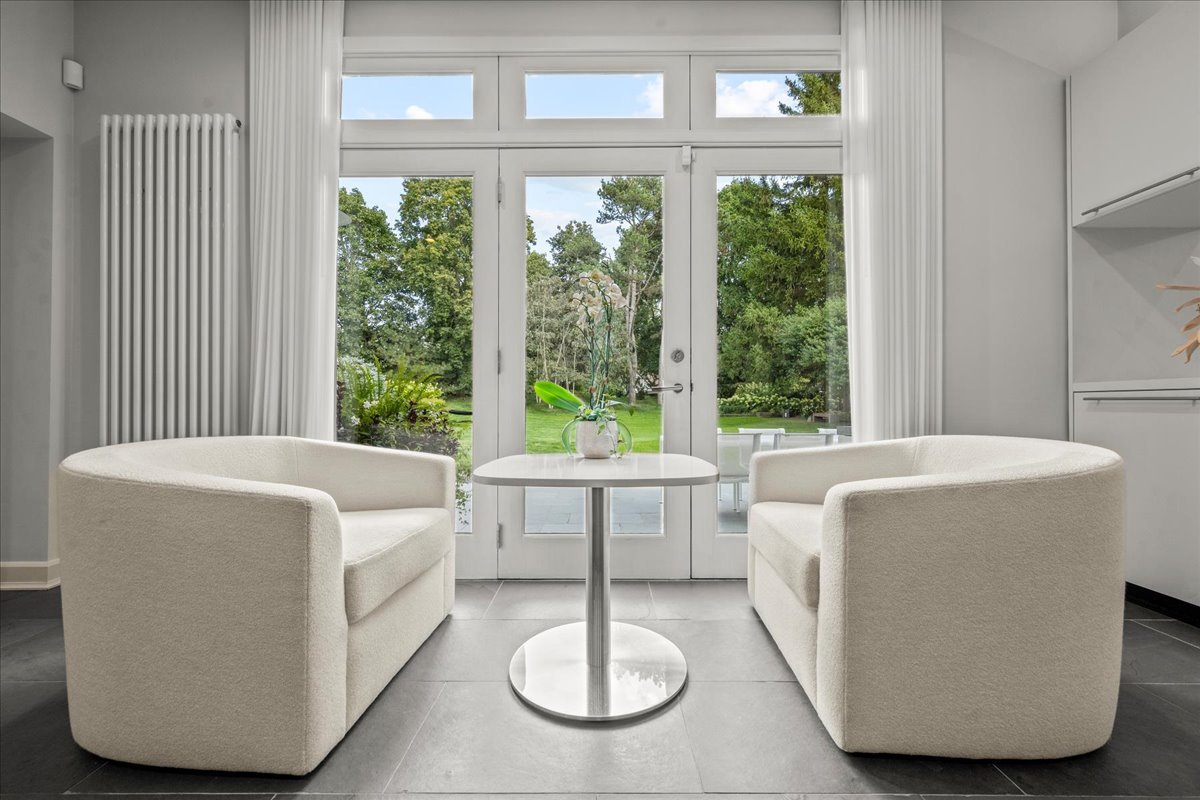 1106 Seneca Road Wilmette, IL 60091 - Photo 31 of 79 a living room with large windows and furniture