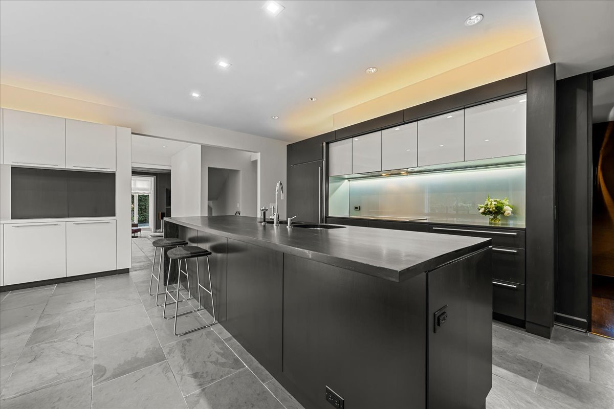 1106 Seneca Road Wilmette, IL 60091 - Photo 35 of 79 a kitchen with stainless steel appliances granite countertop a sink and a refrigerator