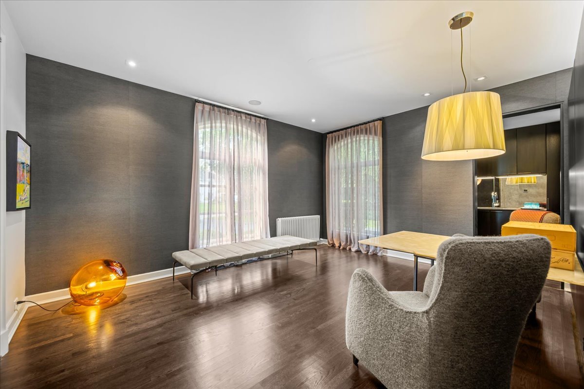 1106 Seneca Road Wilmette, IL 60091 - Photo 38 of 79 a view of a livingroom with furniture wooden floor and window