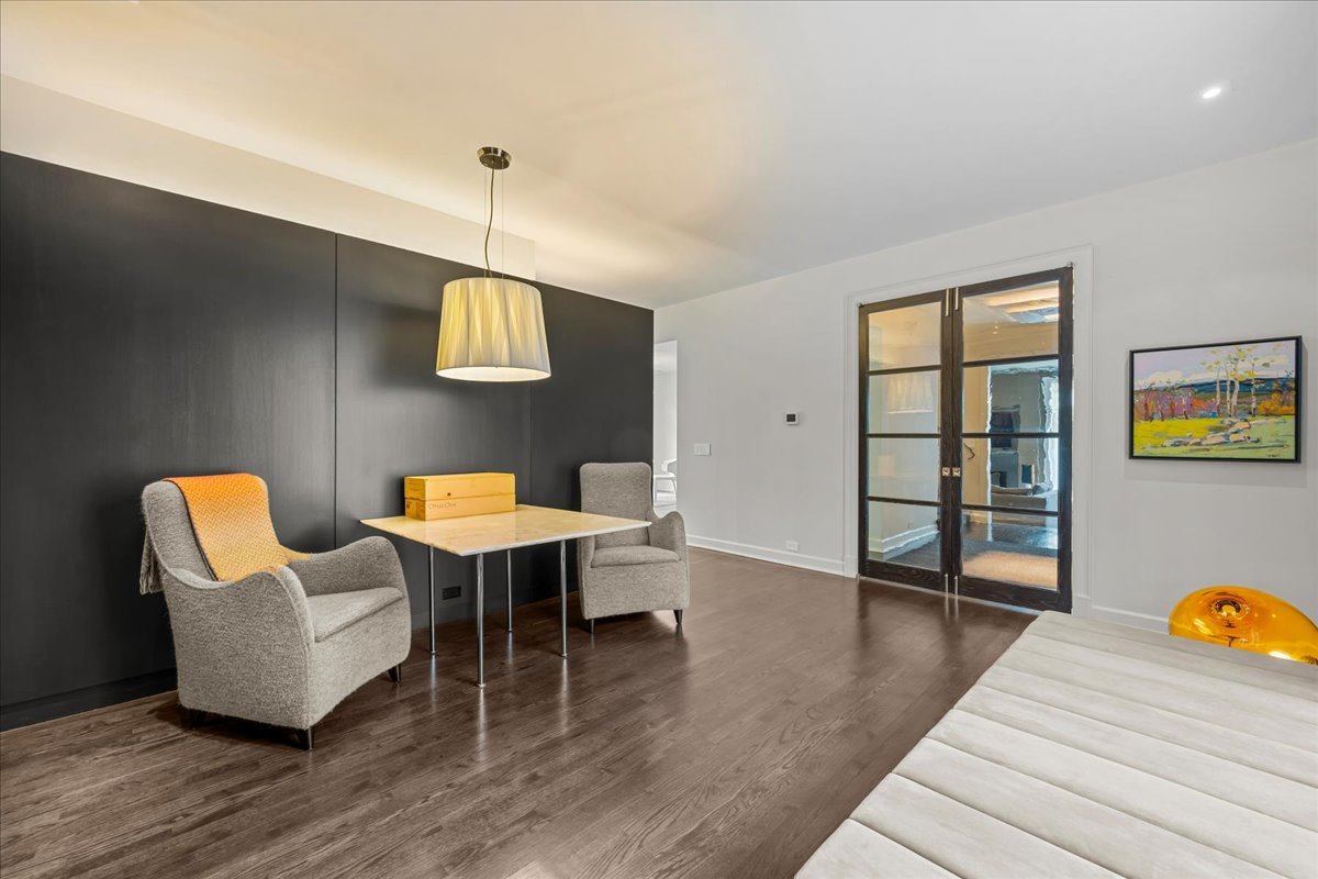 1106 Seneca Road Wilmette, IL 60091 - Photo 40 of 79 a living room with furniture and wooden floor