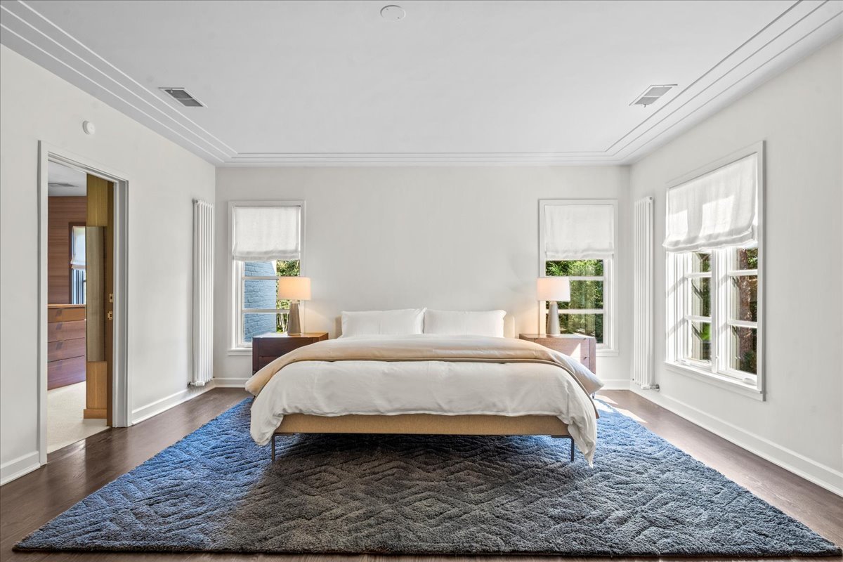 1106 Seneca Road Wilmette, IL 60091 - Photo 45 of 79 a bedroom with a bed rug and wooden floor