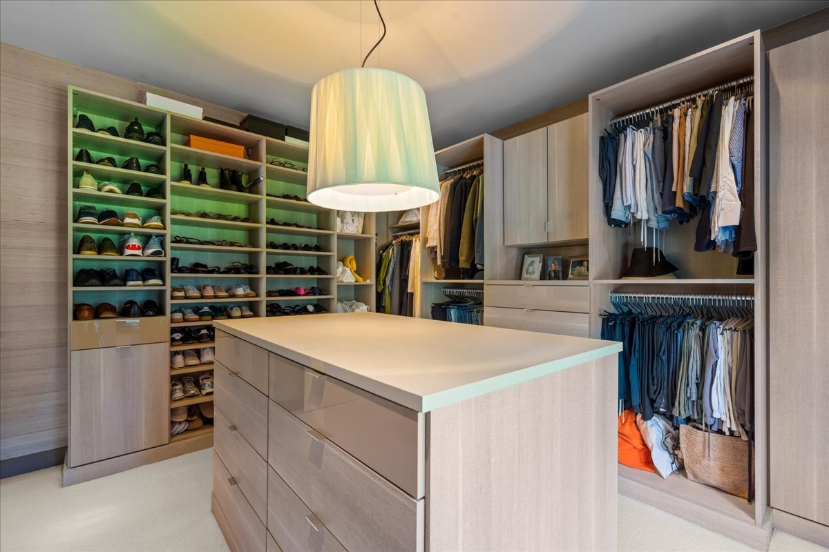 1106 Seneca Road Wilmette, IL 60091 - Photo 47 of 79 a kitchen that has a lot of cabinets a island and appliances in it