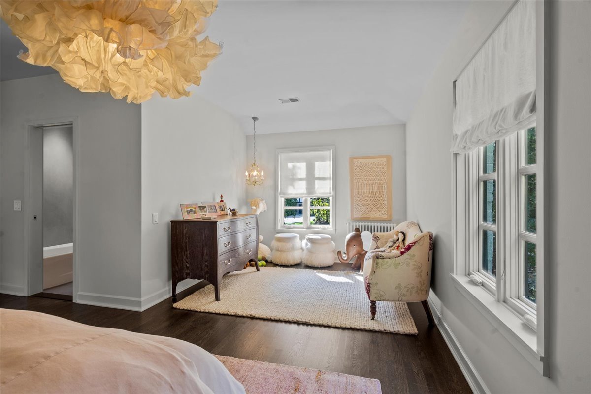 1106 Seneca Road Wilmette, IL 60091 - Photo 54 of 79 a bedroom with a bed and a chandelier