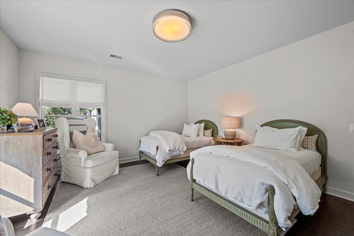 1106 Seneca Road Wilmette, IL 60091 - Photo 58 of 79 a spacious bedroom with two beds and a lamp