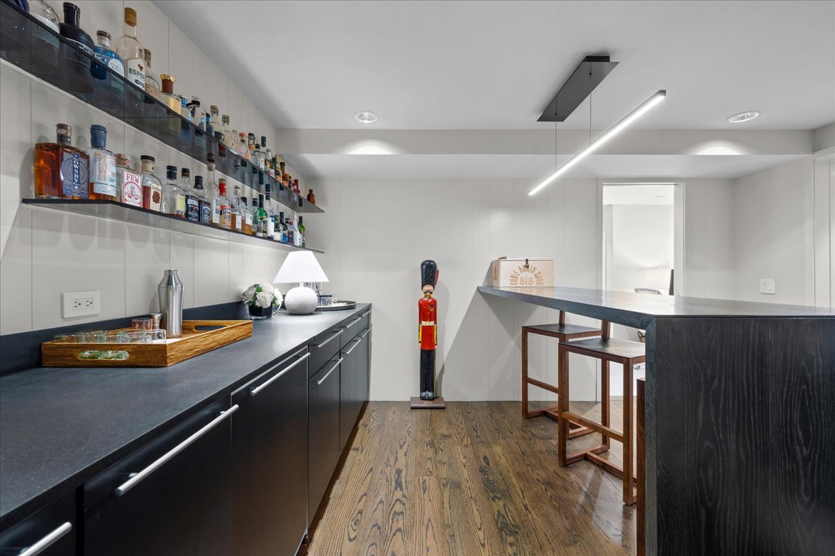 1106 Seneca Road Wilmette, IL 60091 - Photo 62 of 79 a kitchen with stainless steel appliances granite countertop a sink a stove and a wooden floors