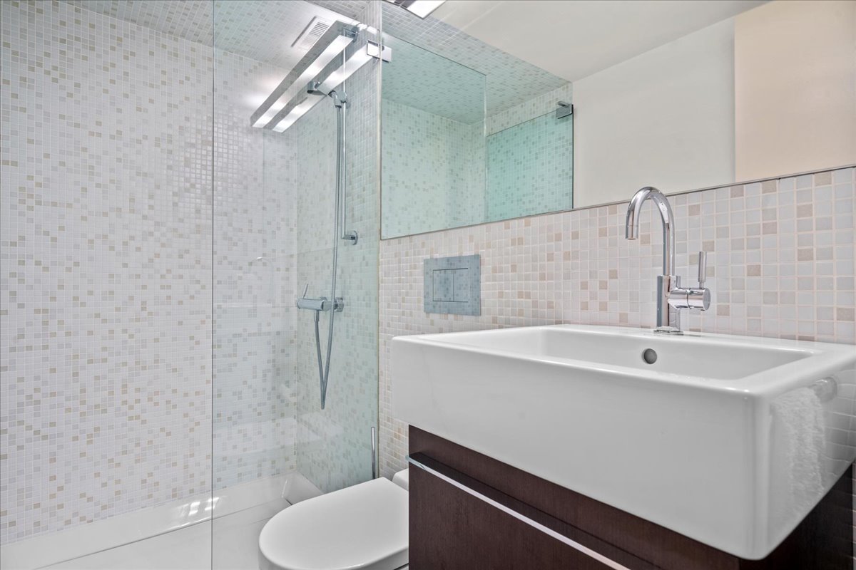 1106 Seneca Road Wilmette, IL 60091 - Photo 67 of 79 a bathroom with a sink a toilet and shower