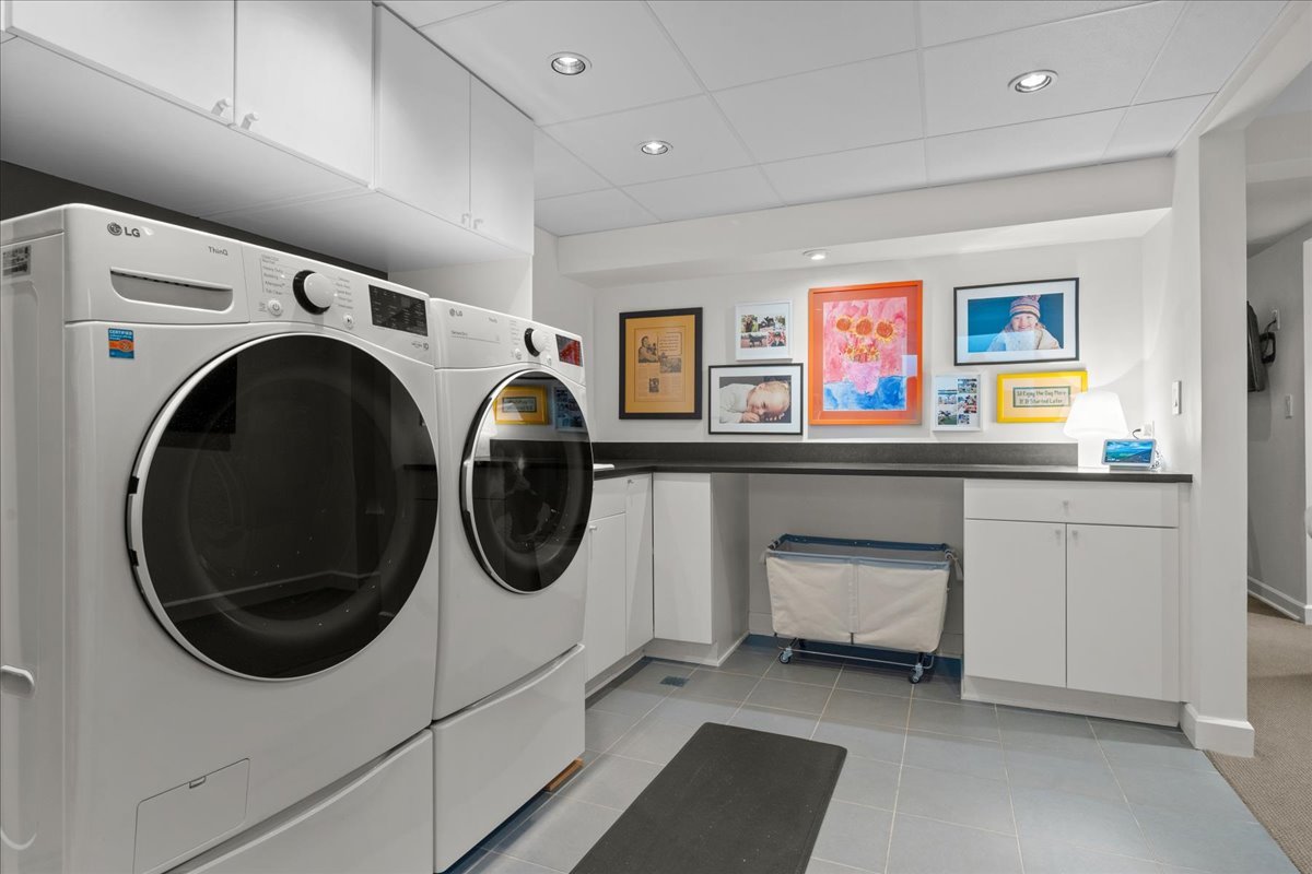 1106 Seneca Road Wilmette, IL 60091 - Photo 68 of 79 a utility room with dryer washer and a fridge