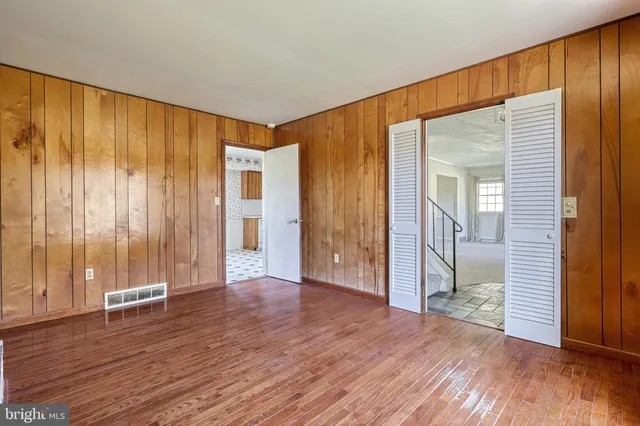 a view of an empty room and a window